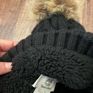 Timberland Black Beanie with Tan Faux Fur Pom